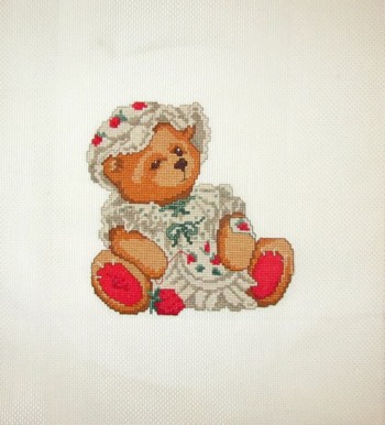 Cross Stitch Embroidery picture of a teddy bear with needlework for framing