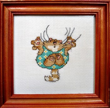 Framed Cross Stitch Embroidery picture of a cat in a green jumpsuit